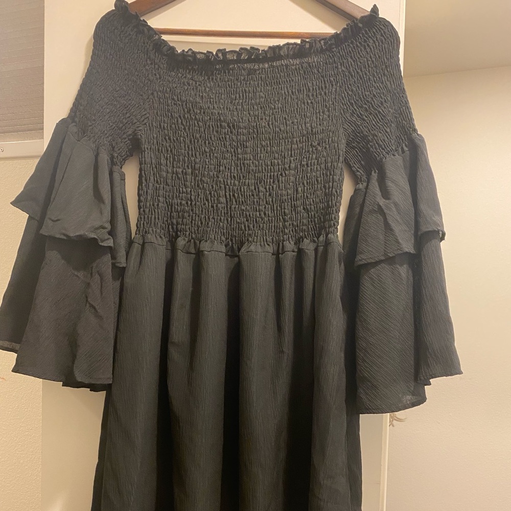 Off the shoulder black dress with bell sleeves
